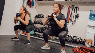 Two women doing team training together